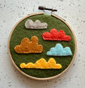 Felt cloud embroidery on hoop, green