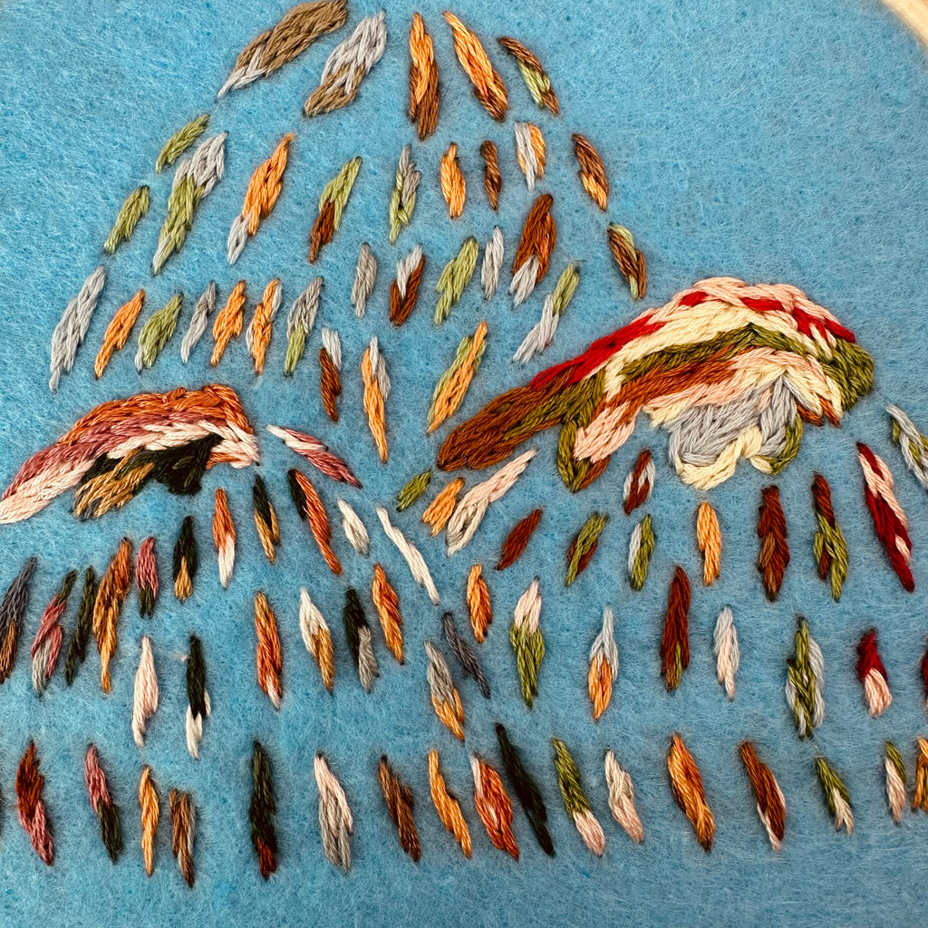Hand stitched mountain embroidery