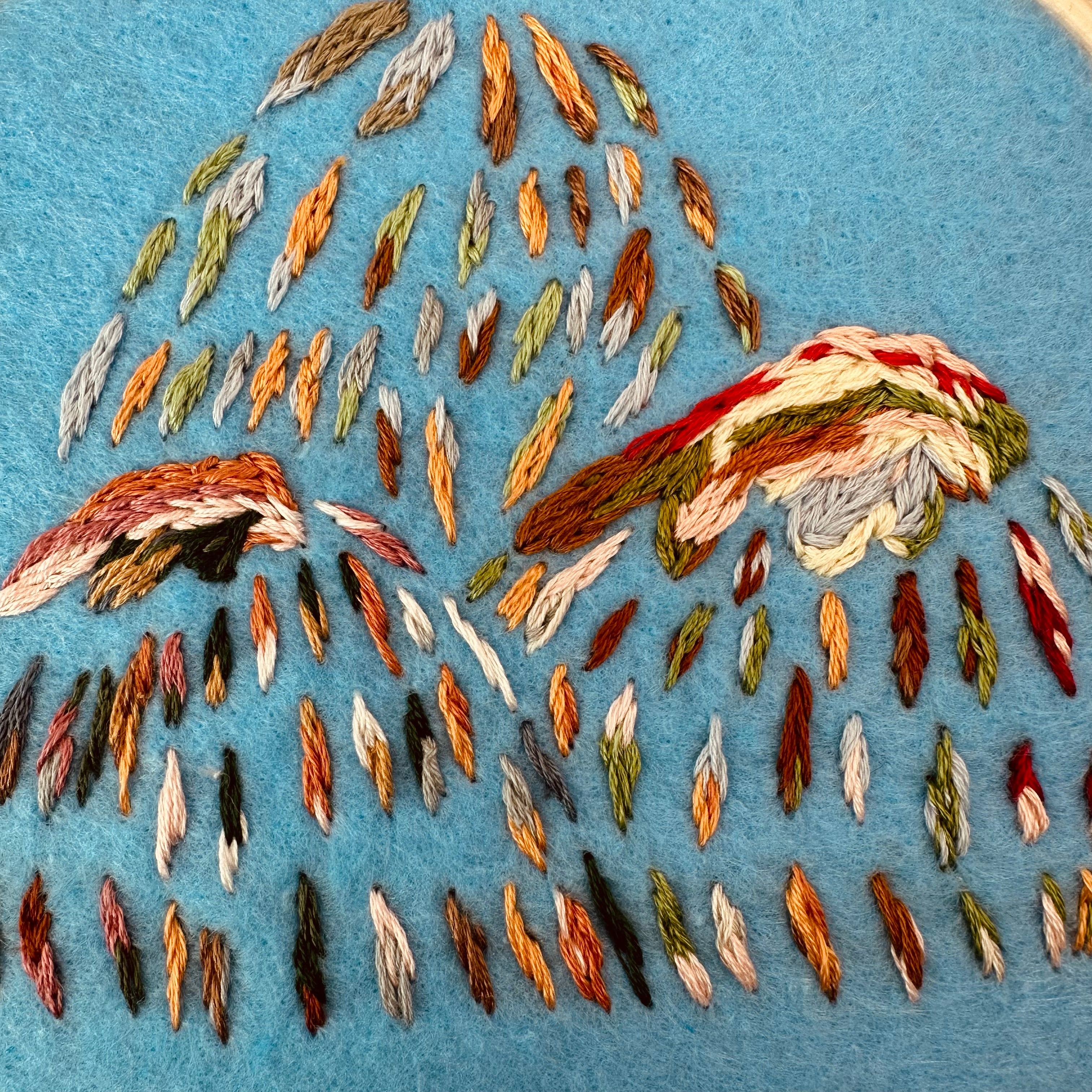 Hand stitched mountain embroidery