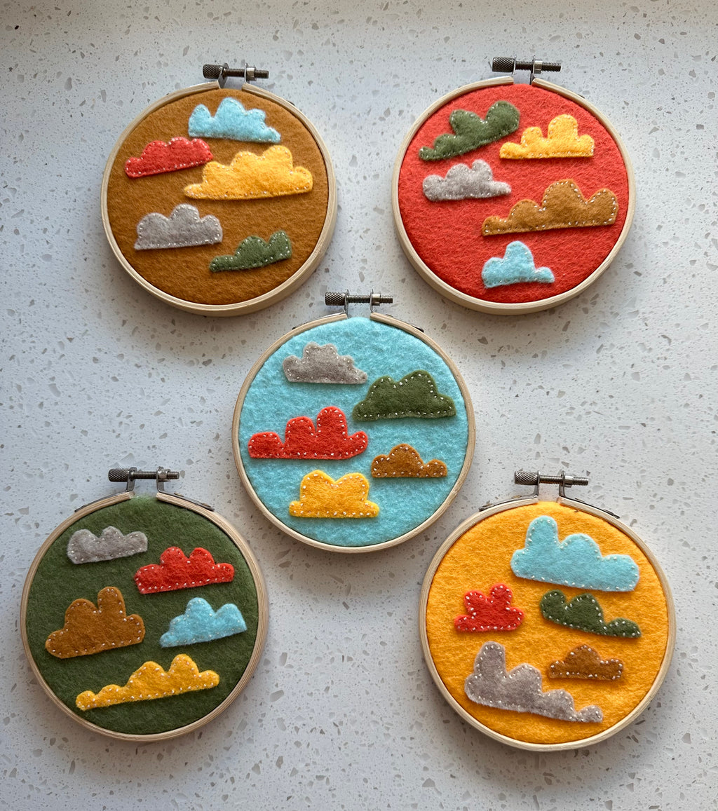 Felt cloud embroidery on hoop, green