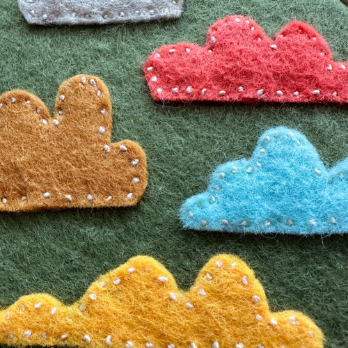 Felt cloud embroidery on hoop, green