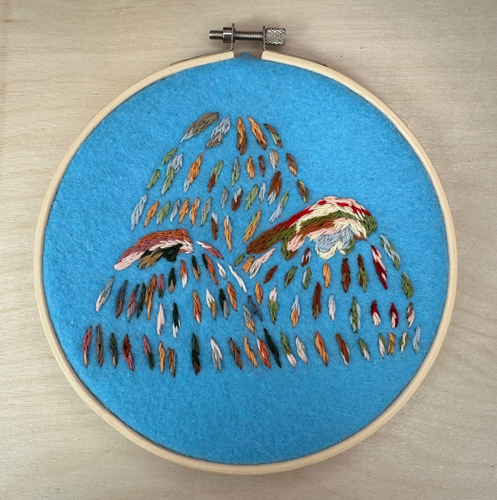 Hand stitched mountain embroidery