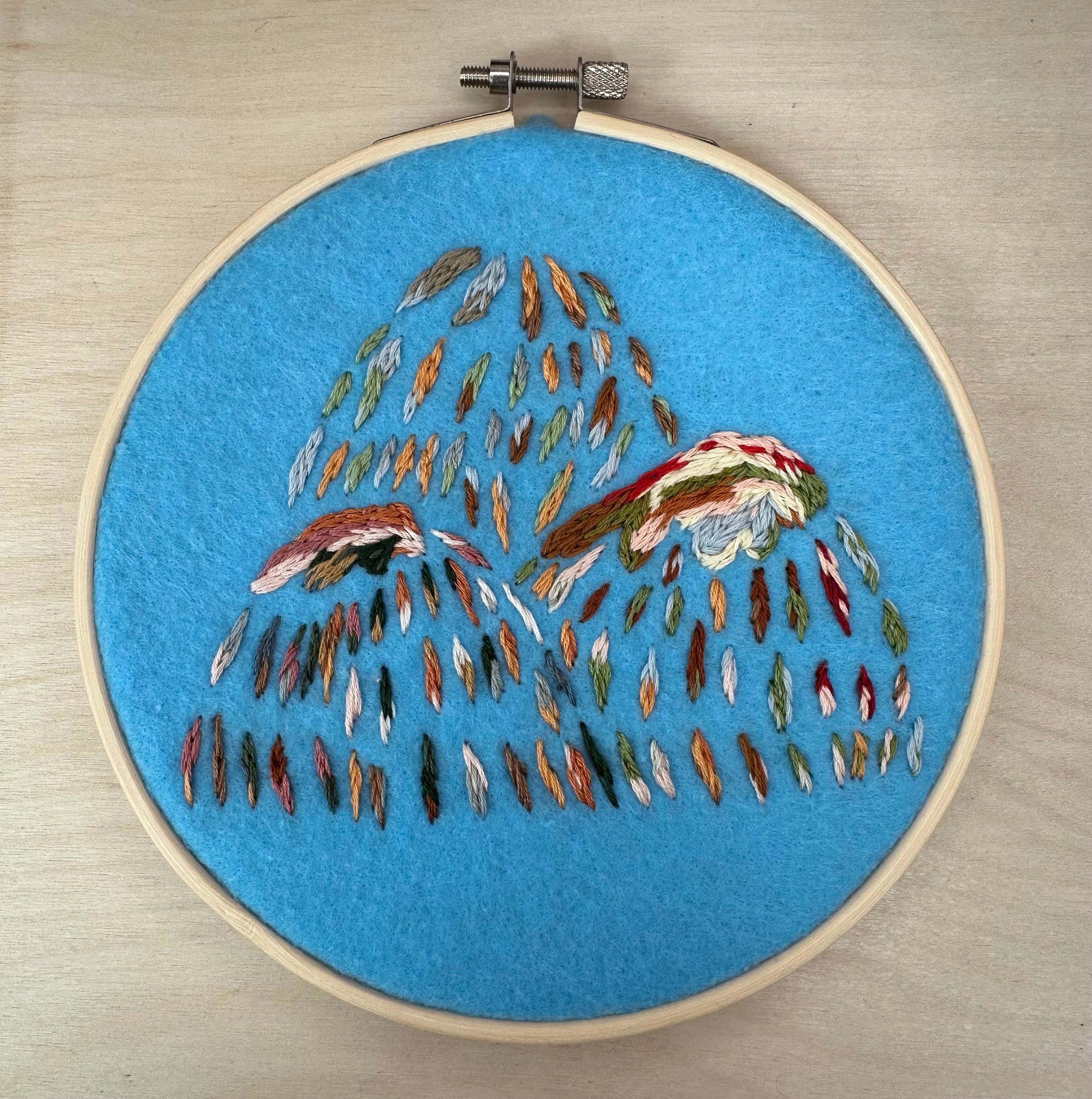 Hand stitched mountain embroidery