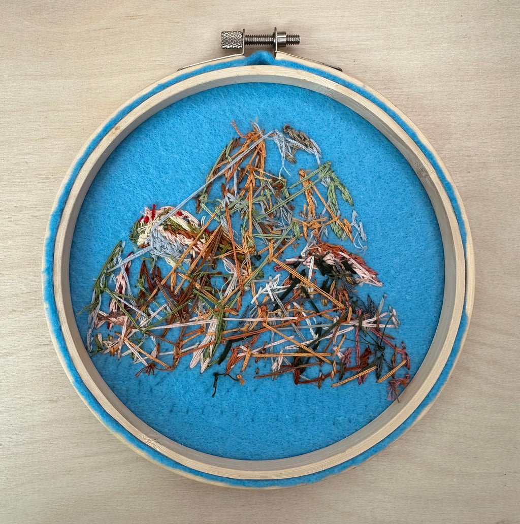 Hand stitched mountain embroidery