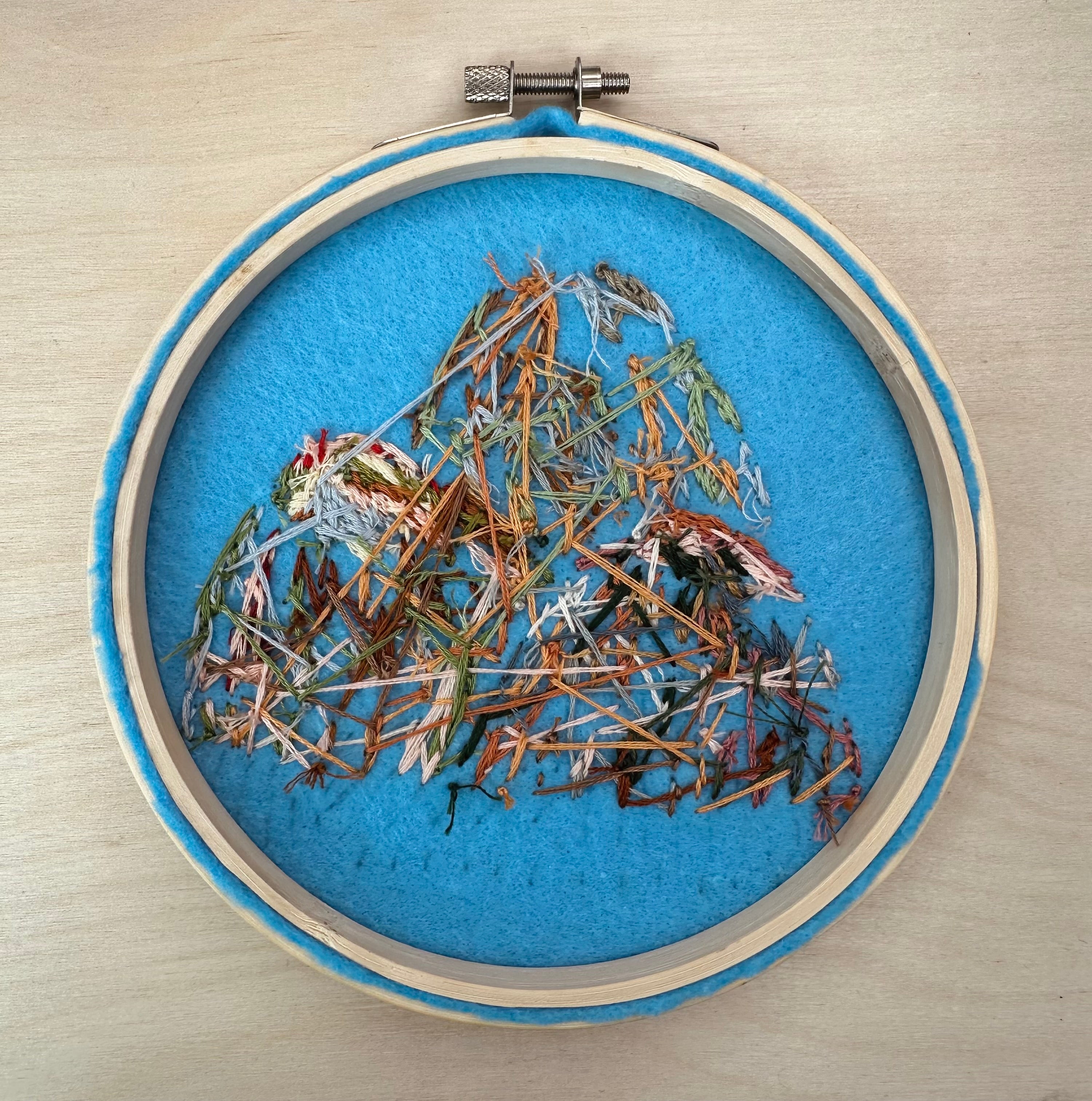 Hand stitched mountain embroidery