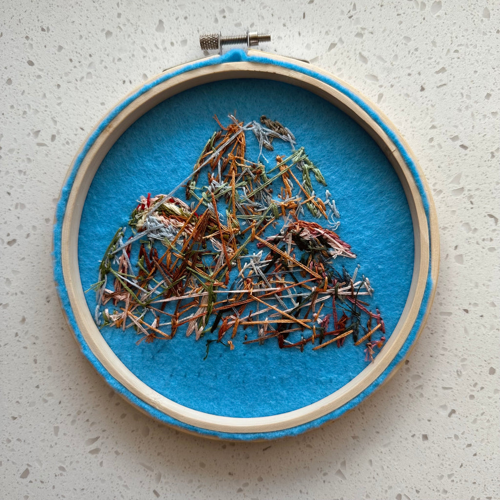 Hand stitched mountain embroidery