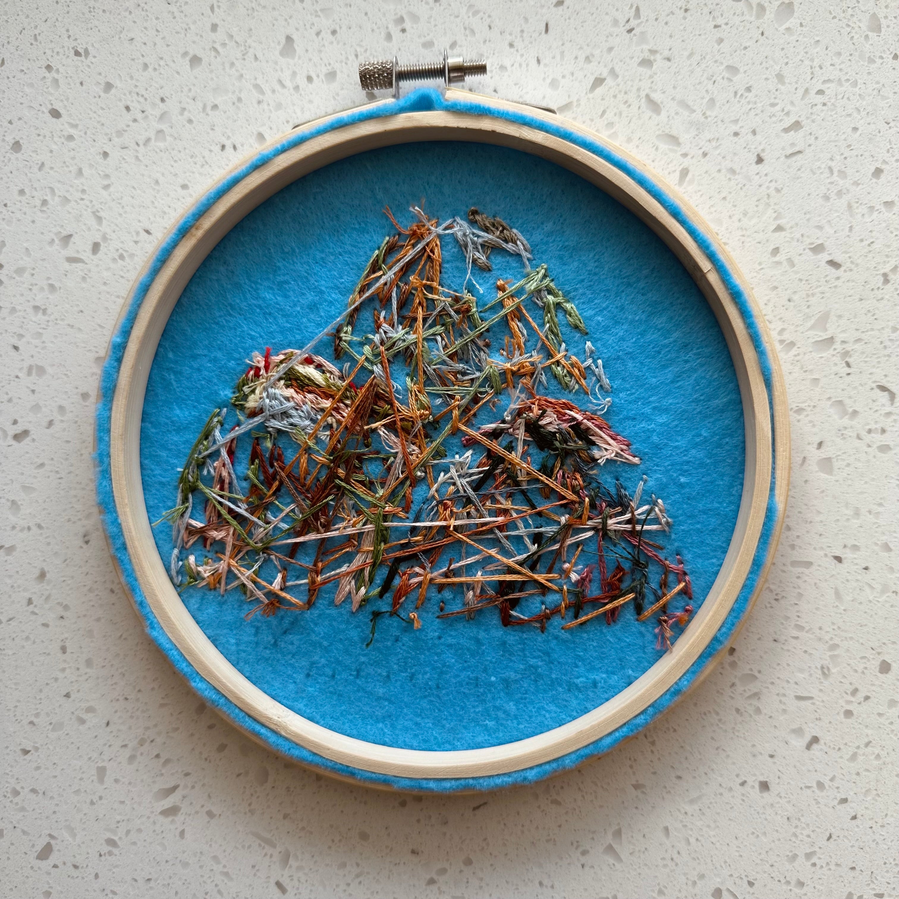 Hand stitched mountain embroidery