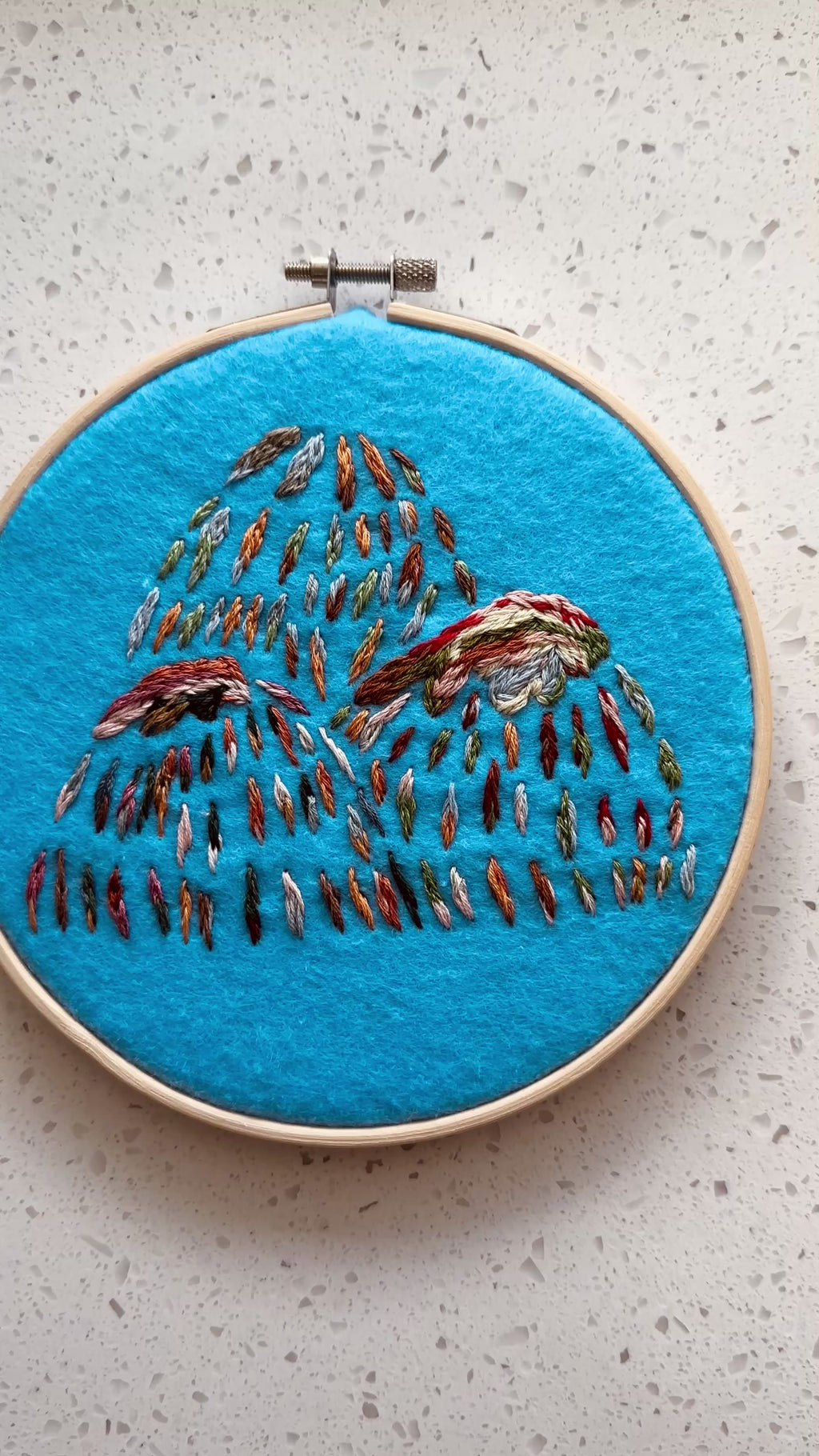 Hand stitched mountain embroidery
